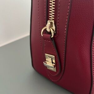 Beautiful rich deep red purse. Henri Bendel. With crossbody strap.